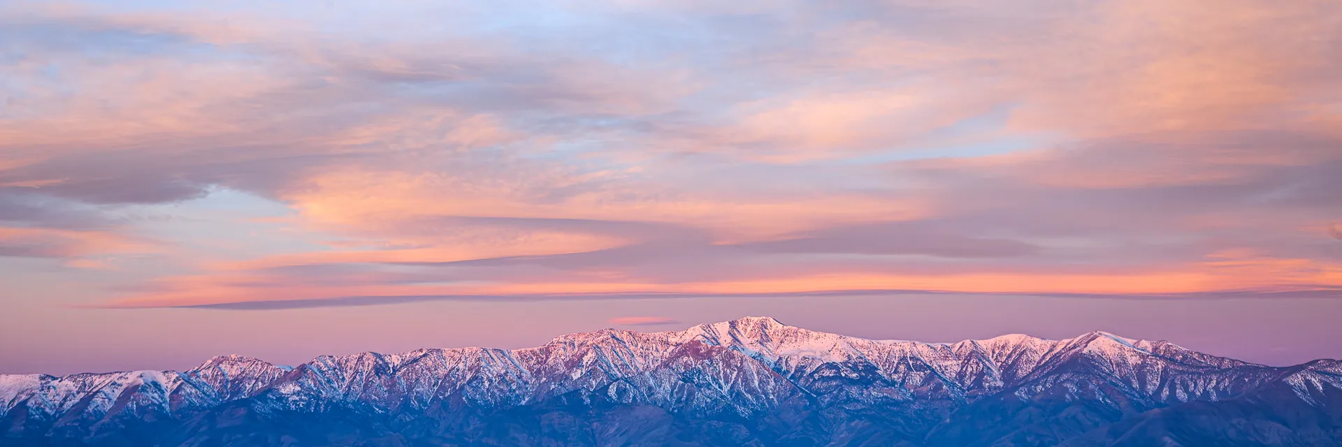 Sunset over snow-capped mountains, printed