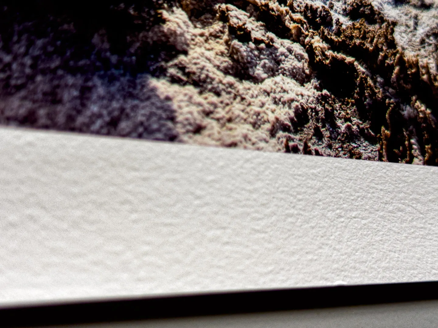 Close-up of the paper surface at the edge of a print